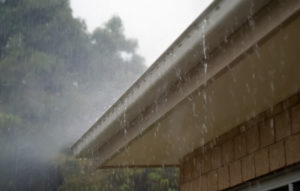 rain pouring down gutter